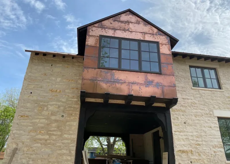 Copper metal panel facade on a stone building for Metal Roof Coating in Country Club